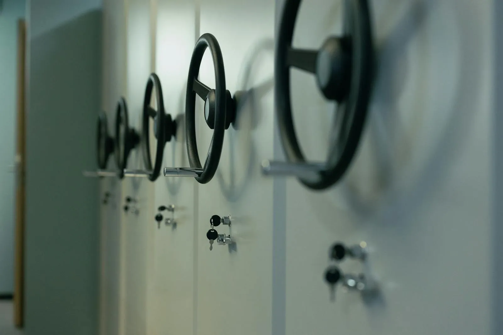 Row of industrial safes with manual dial locks and keys